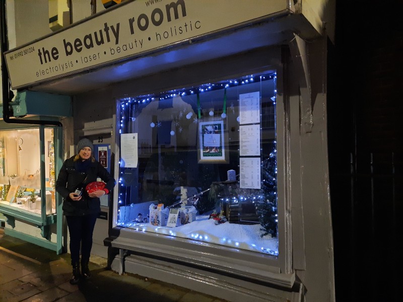 The Beauty Room, winner of 2020 Winning Windows and proprietor Debra Woodberry. 