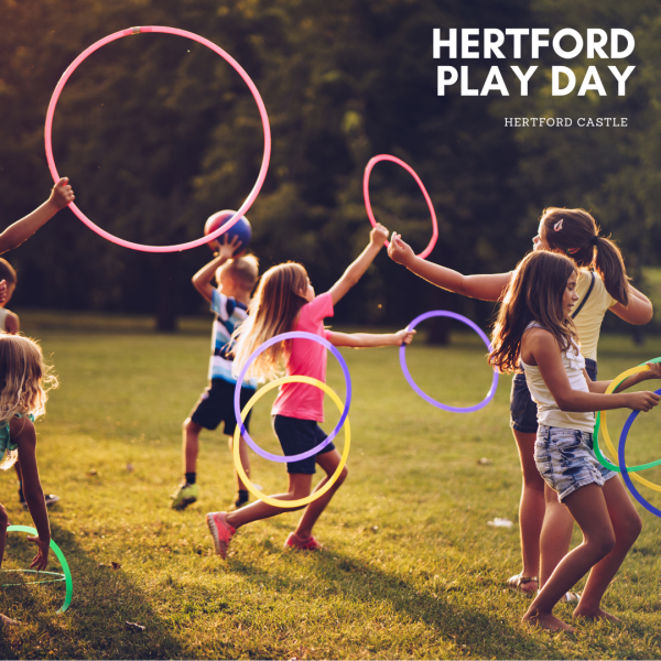 Image shows children playing outside with hoops